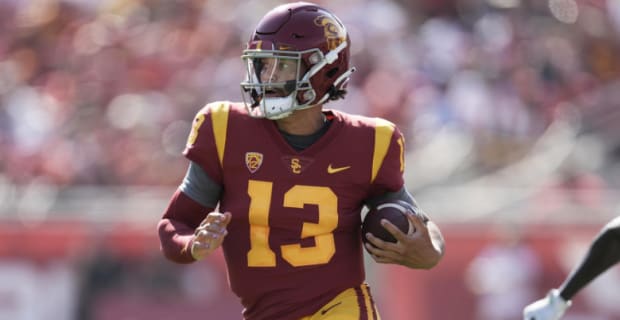 USC Trojans quarterback Caleb Williams makes a play during a college football game.